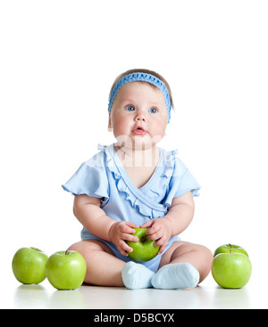 Adorable kid with green apples isolated on white background Stock Photo