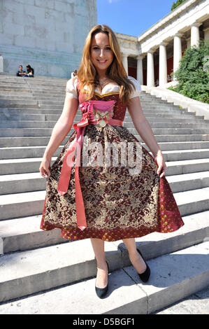 TV presenter Alina Baumann (wearing Trentini Couture by Julia Trentini)poses on the stairs in front of Bavaria statue on the Oktoberfest grounds in Munich, Germany, 02 September 2010. She wears an exclusive dirndl dress and presents the current dirndl trend. As every year, many Oktoberfest visitors will be wearing the local costumes. Photo: Felix Hoerhager Stock Photo