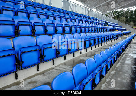 Seats in a grandstand at a sports venue Stock Photo