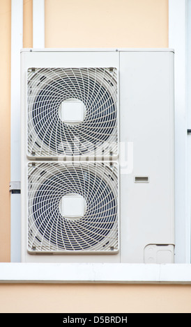 The air conditioner condensing unit (CDU) with twin fans. Stock Photo