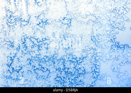 Frost crystals make unique patterns on window Stock Photo