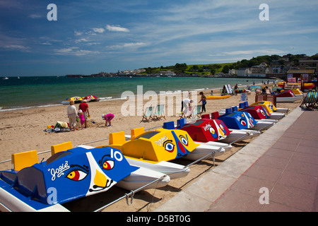 Colourful pedal-boats on Swanage beach in Dorset England UK Stock Photo