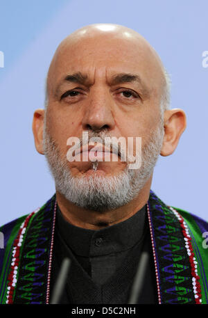 Afghan President Hamid Karzai gives a press conference with German Chancellor Merkel (not depicted) on the upcoming Afghanistan conference in London in the Chancellery in Berlin, Germany, 27 January 2010. The German government plans to prepare the retreat of German soldiers from Afghanistan with a new strategy until 2014, while the number of soldiers is increased by 850 to 5350 and Stock Photo