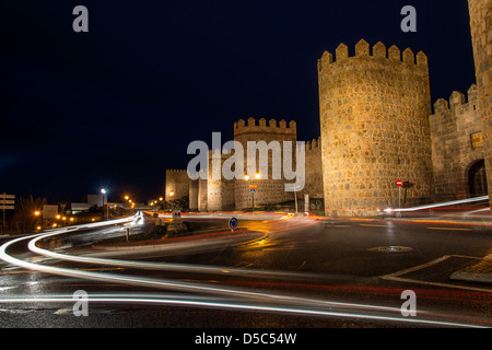 Night view of the medieval city walls with car trail lights, Avila, Castile and León, Spain Stock Photo