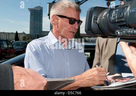 Harrison Ford signing autographs outside SAT.1 TV studios whilst promoting the new movie 'Cowboys & Aliens' in Germany. Berlin, Stock Photo