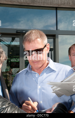 Harrison Ford signing autographs outside SAT.1 TV studios whilst promoting the new movie 'Cowboys & Aliens' in Germany. Berlin, Stock Photo