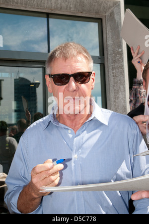 Harrison Ford signing autographs outside SAT.1 TV studios whilst promoting the new movie 'Cowboys & Aliens' in Germany. Berlin, Stock Photo