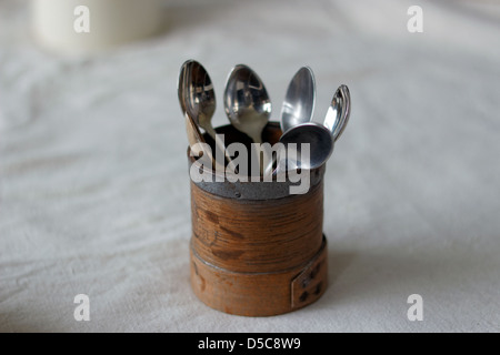 Wooden tea caddy filled with teaspoons Stock Photo