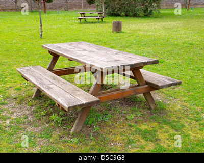 Table and benchs in a park. An outdoor scene. Stock Photo