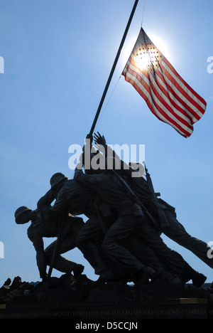 Iwo Jima Memorial with sunlit flag in Arlington, Virginia – across the river from Washington D.C., USA. Stock Photo