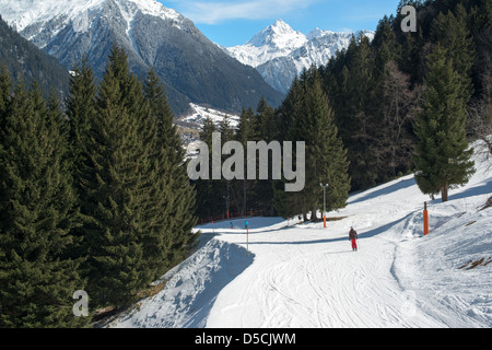 Ski slope in a skiing resort in the Alpes in a valley of Montafon Stock Photo