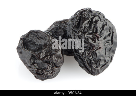 Dried plum fruits - prunes isolated on white background. Stock Photo