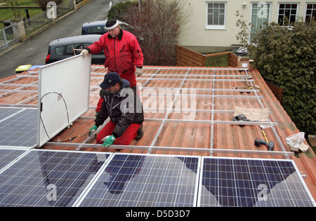 Magdeburg, Germany, installing a solar power system on the roof of a family home Stock Photo