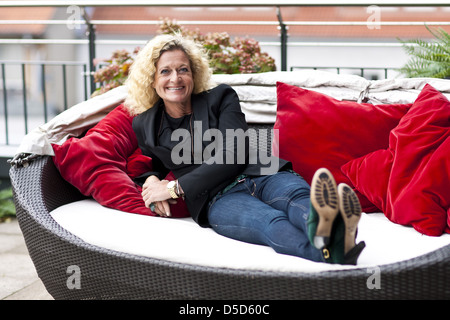 Susanne Froehlich promotes her new book 'Der Hund, die Kraehe, das Om...und Ich!' during a photocall at East Hotel. Hamburg, Stock Photo