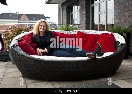 Susanne Froehlich promotes her new book 'Der Hund, die Kraehe, das Om...und Ich!' during a photocall at East Hotel. Hamburg, Stock Photo