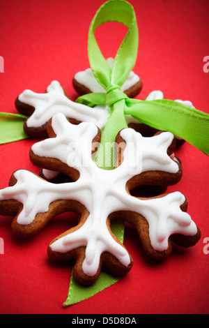 Closeup of snowflake gingerbread cookies on red Stock Photo