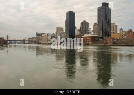 View of Manhattan Upper East Side and Queensboro Bridge, seen from Roosevelt Island, New York. Stock Photo