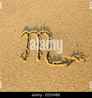 Zodiac sign Scorpio, drawn on the facture beach sand. (zodiac signs series) Stock Photo