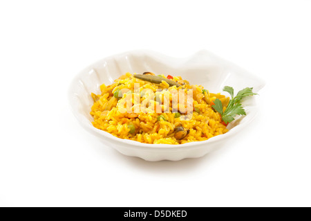traditional Spanish plate (paella) made of rice, spices, seafood, chicken, vegetables e.t.c. Stock Photo