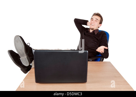 Portrait of a young businessman with laptop relaxing on chair Stock Photo