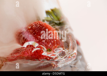 Strawberries in ice Stock Photo