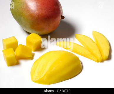 Whole mango with freshly cut slices and chunks Stock Photo