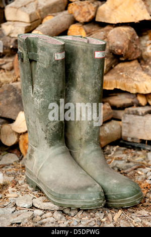 A muddy pair of Hunter Wellington boots Stock Photo
