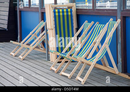 Bournemouth, Dorset UK 29 March 2013. Bank Holiday and empty deckchairs on Bournemouth Pier on Easter Good Friday Stock Photo
