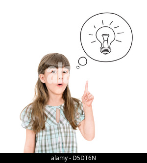 Clever little girl with a bright idea symbol pointing upwards with her finger to gain attention. Isolated on white. Stock Photo