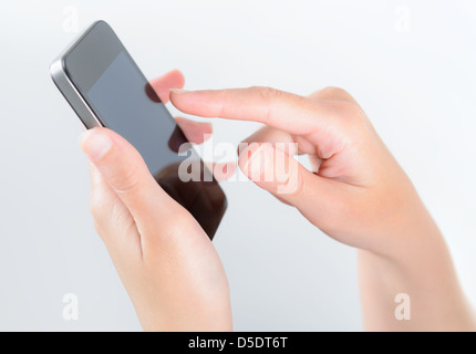 Woman’s hands are using a mobile smartphone. Stock Photo