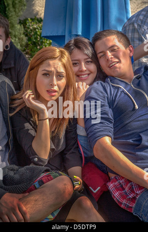Hispanic and Caucasian high school students socialize on campus in Southern California. Stock Photo
