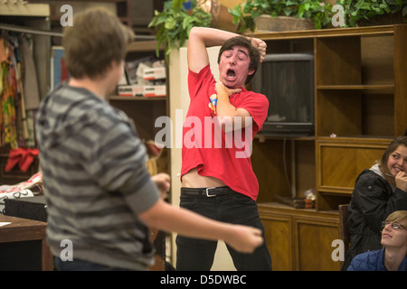 Two high school drama drama students perform improvisational theatre for their classmates in San Clemente, CA. Stock Photo