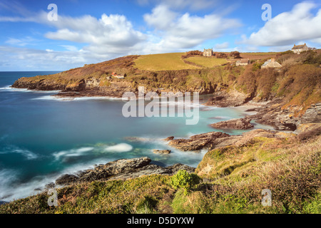 Cornwall's Prussia Cove captured using a long shutter speed to blur the movement in the sea and clouds Stock Photo
