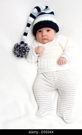 Beautiful baby in knitted hat Stock Photo