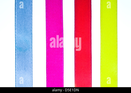 Red, yellow, orange, blue shiny gradient curling ribbons for design.  Stock Photo