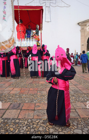 Masked child  in Penitence Costume for Easter, an ancient hispanic tradition. Tunja, Boyacá, Andes, Colombia, South America Stock Photo