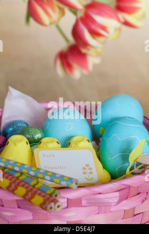 Easter basket with out-of-focus background flowers Stock Photo