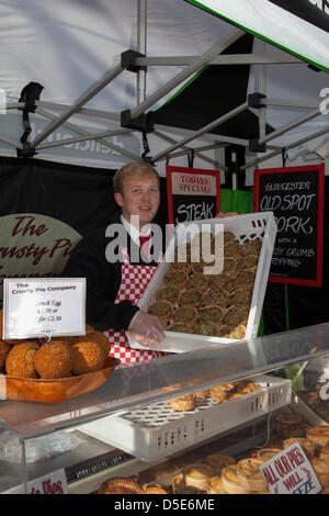 The City of York, Yorkshire, UK Good Friday 29th March, 2013. Oliver Edhouse, 18 from Halifax from The Crusty Pie Company at the special annual Easter Crafts and Food Fayre held  in St Sampson's Square and Parliament Street where street vendors exhibit their wares filling the streets with the taste and smells of good Yorkshire fare. Stock Photo