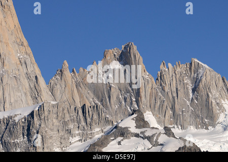 Aguja Mermoz,.The flank of Mount Fitzroy is to the left.  To the right of Mount Fitzroy are Aguja Val de Vois, Aguja Mermoz, Stock Photo