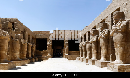 Luxor. Egypt. Theatrical porticoed courtyard with Osiris columns in the Temple of Ramses III at the Temple of Amun in Karnak. Stock Photo