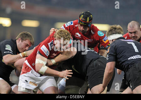 RaboDirect Pro 12 - Newport Gwent Dragons v Scarlets at the Millennium Stadium in Cardiff : Scarlets Samson Lee takes on his opposite number Dan Way of Newport Gwent Dragons. Stock Photo