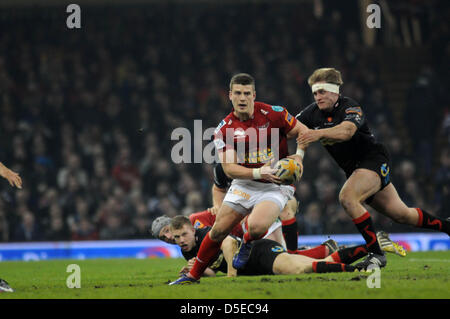 RaboDirect Pro 12 - Newport Gwent Dragons v Scarlets at the Millennium Stadium in Cardiff : Scarlets Scott Williams is tackled by Nick Cudd of Newport Gwent Dragons. Stock Photo