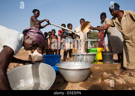 Water is drawn from a bore hole near the village of Nandom, in northern Ghana. Stock Photo