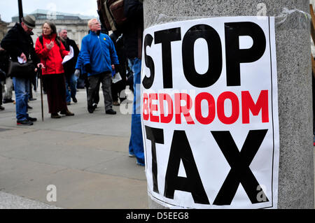 A poster on a wall reading ' stop bedroom tax' in Trafalgar Square, London, UK. Stock Photo