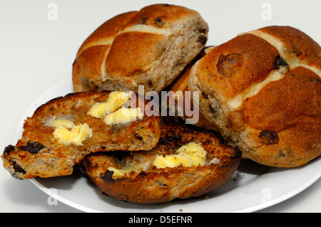 Toasted Organic Wholemeal Hot Cross Buns with Butter Stock Photo