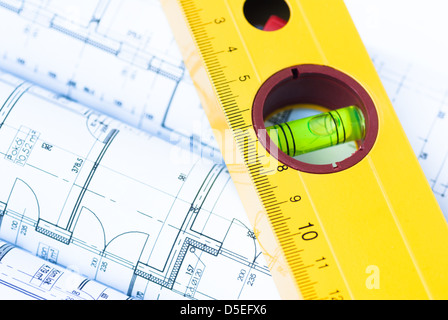 Construction rolls and plans and yellow helmet Stock Photo - Alamy