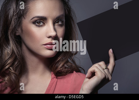 Smart lady holding an empty sheet Stock Photo