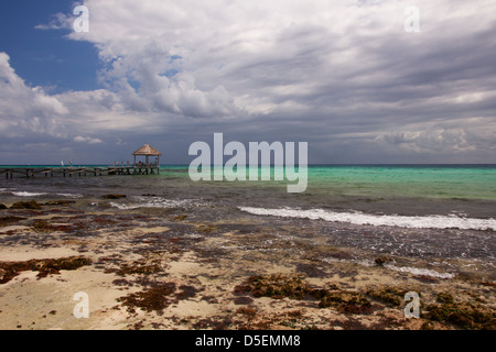 Stormclouds gather of a perfect Caribbean beach in Playa del Carmen, Quintana Roo, Mexico. Stock Photo