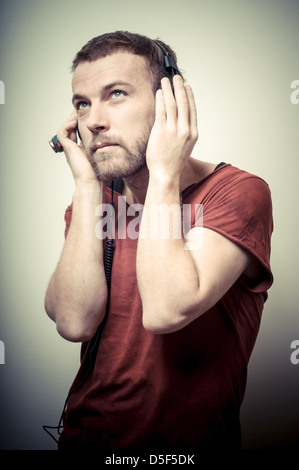 vintage portrait of fashion guy with headphones Stock Photo
