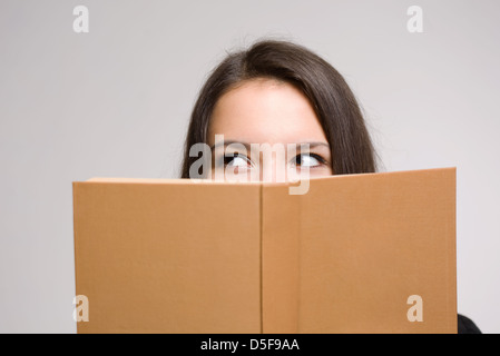 Portrait of a confident young brunette student. Stock Photo